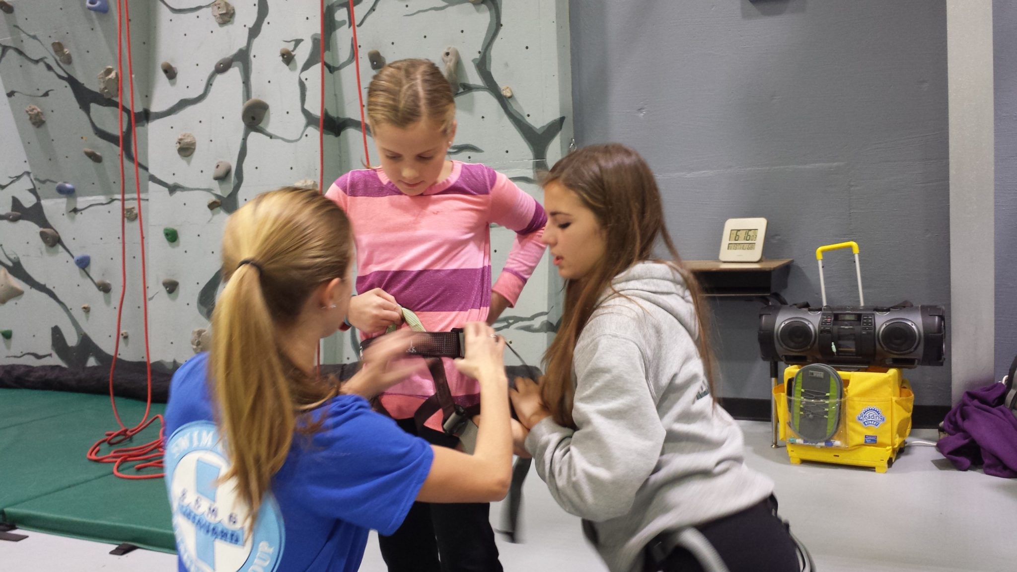 TAASC students teaching younger climbers
